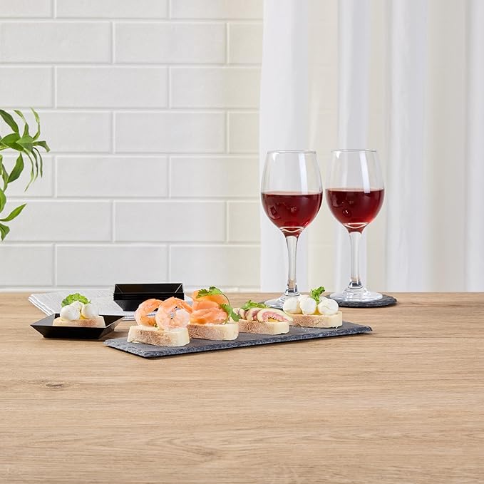 Restaurantware Slate Serving Trays 4 Pack of 11.8" x 4" Foam Feet Charcuterie Stone Plates Rustic Edges Freezable Black Serving Display Cheese Boards for Kitchen, Gourmet, Dining, Parties