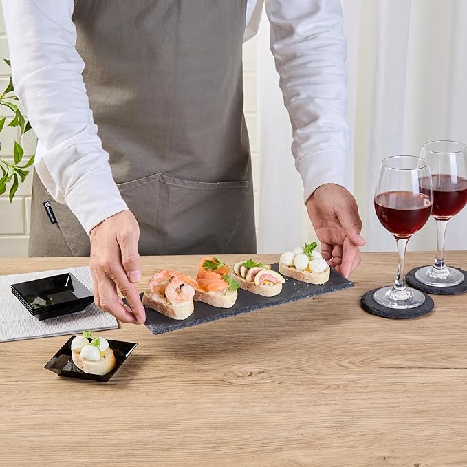 Restaurantware Slate Serving Trays 4 Pack of 11.8" x 4" Foam Feet Charcuterie Stone Plates Rustic Edges Freezable Black Serving Display Cheese Boards for Kitchen, Gourmet, Dining, Parties